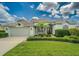 Charming single-story home features a lush lawn and well-manicured landscaping at 2146 Gold Dust Ct, Trinity, FL 34655