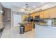 Well-appointed kitchen with granite countertops, stainless steel appliances, and a central island at 2146 Gold Dust Ct, Trinity, FL 34655