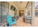 Covered outdoor patio with comfortable seating and a mounted television at 2146 Gold Dust Ct, Trinity, FL 34655