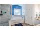 Bathroom boasting a soaking tub, glass shower, and modern fixtures at 2507 Dewberry St, Valrico, FL 33596