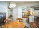 Dining area leading to a kitchen equipped with wooden cabinets, modern appliances, and an open layout at 2507 Dewberry St, Valrico, FL 33596