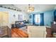 The living room has vaulted ceilings, wood floors, and a ceiling fan at 2507 Dewberry St, Valrico, FL 33596