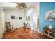The living room is an open space with wood floors, ceiling fan, and bright natural light at 2507 Dewberry St, Valrico, FL 33596