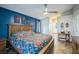Spacious primary bedroom has en-suite bathroom, ceiling fan, and decorative accent wall, providing an inviting retreat at 2507 Dewberry St, Valrico, FL 33596