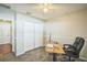 Office space features a closet, ceiling fan, chair railing, and a functional workspace at 2507 Dewberry St, Valrico, FL 33596