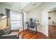 The bright office features wood floors, and neutral walls and trim at 2507 Dewberry St, Valrico, FL 33596