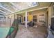 The covered patio area has comfortable seating and offers an extension of the indoor living space at 2507 Dewberry St, Valrico, FL 33596