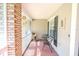 Cozy screened-in patio with brick column and view of backyard at 2507 Dewberry St, Valrico, FL 33596