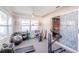 Bright sunroom equipped with workout equipment and access to the outdoors at 2507 Dewberry St, Valrico, FL 33596