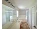Bright bathroom featuring a double vanity, bathtub, and a separate glass-enclosed shower at 2614 Queen Alberta Dr, Valrico, FL 33594
