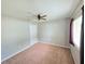 Neutral bedroom featuring carpet, ceiling fan, closet and natural light from a window at 2614 Queen Alberta Dr, Valrico, FL 33594