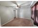 Bedroom features neutral walls, carpeting, and a window for natural light, creating a warm and inviting space at 2614 Queen Alberta Dr, Valrico, FL 33594