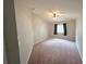 Cozy bedroom with neutral walls, carpet, ceiling fan, and a window for natural light at 2614 Queen Alberta Dr, Valrico, FL 33594