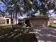 Charming single-Gathering home with a two-car garage and well-maintained lawn in a serene residential neighborhood at 2614 Queen Alberta Dr, Valrico, FL 33594