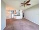 Spacious living area offering neutral walls and carpeting, providing a flexible space for various layouts at 2614 Queen Alberta Dr, Valrico, FL 33594