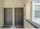 Condo entrance showcasing the unit front doors with visible unit numbers at 2650 Countryside Blvd # A210, Clearwater, FL 33761