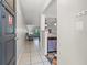 Inviting foyer featuring neutral tile flooring leading into the living spaces at 2650 Countryside Blvd # A210, Clearwater, FL 33761
