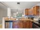 Kitchen showcasing granite countertops, stainless steel appliances, and breakfast bar at 2650 Countryside Blvd # A210, Clearwater, FL 33761