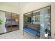 Cozy lanai with a woven bench, a glass sliding door to the living space at 2650 Countryside Blvd # A210, Clearwater, FL 33761