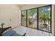Outdoor patio with tile floors, plants, with a relaxing lounge chair at 2650 Countryside Blvd # A210, Clearwater, FL 33761