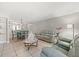 Open-concept living room showcasing dining area, tile floors, and comfortable seating at 2650 Countryside Blvd # A210, Clearwater, FL 33761