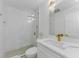 Modern bathroom featuring tiled shower, sleek fixtures, and glass door in a well-lit space at 2700 Bayshore Blvd # 5210, Dunedin, FL 34698