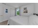 Cozy bedroom featuring bright natural light from window view and crisp white linen bedding at 2700 Bayshore Blvd # 5210, Dunedin, FL 34698