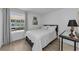 Bright bedroom with wood-look flooring, a queen bed, and natural light from the exterior at 2700 Bayshore Blvd # 5210, Dunedin, FL 34698