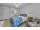 Comfortable bedroom showcasing chandelier, decor, and a patterned bedspread at 2700 Bayshore Blvd # 5210, Dunedin, FL 34698