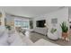 Inviting living room with comfortable seating, a large TV, and a serene atmosphere at 2700 Bayshore Blvd # 5210, Dunedin, FL 34698