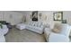 Stylish living room featuring a comfortable sectional, modern decor, and bright natural light at 2700 Bayshore Blvd # 5210, Dunedin, FL 34698