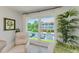 Bright, airy window view from the living room overlooking the community and parking area at 2700 Bayshore Blvd # 5210, Dunedin, FL 34698