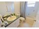 Neutral bathroom features a single sink vanity and a shower/tub combination at 2826 Martha Ln, Land O Lakes, FL 34639