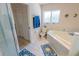 This bathroom features a large soaking tub with tile surround and a separate glass-enclosed shower at 2826 Martha Ln, Land O Lakes, FL 34639