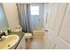 Neutral bathroom features a single sink vanity and a shower/tub combination at 2826 Martha Ln, Land O Lakes, FL 34639