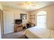 This cozy bedroom has a quaint workspace, and a comfortable bed with a window providing natural light at 2826 Martha Ln, Land O Lakes, FL 34639