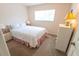 Bright bedroom with carpeted floors and a window overlooking the side yard at 2826 Martha Ln, Land O Lakes, FL 34639