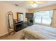 Spacious bedroom featuring neutral walls, carpet, and a large window for natural light at 2826 Martha Ln, Land O Lakes, FL 34639