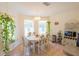Bright dining area featuring natural light, neutral tones, and space for a microwave and wine rack at 2826 Martha Ln, Land O Lakes, FL 34639