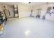 Spacious garage featuring sealed concrete floors and ample space for storage at 2826 Martha Ln, Land O Lakes, FL 34639