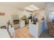 Bright, open kitchen boasts modern appliances, a breakfast bar, and ample storage and dining space at 2826 Martha Ln, Land O Lakes, FL 34639