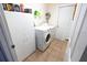 Functional laundry area featuring a washer, dryer and ample storage space at 2826 Martha Ln, Land O Lakes, FL 34639