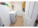 Functional laundry area featuring a washer, dryer and ample storage space at 2826 Martha Ln, Land O Lakes, FL 34639