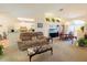 Cozy living room with neutral tones, an open layout, and a dining area perfect for entertaining guests at 2826 Martha Ln, Land O Lakes, FL 34639