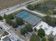 Aerial view featuring tennis courts, a skate park and parking at 2826 Martha Ln, Land O Lakes, FL 34639