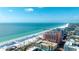 Panoramic aerial view of the beachfront community with white sands and crystal waters at 301 S Gulfview Blvd # 301, Clearwater Beach, FL 33767