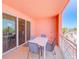 Private balcony with a table and chairs, perfect for outdoor dining and relaxation at 301 S Gulfview Blvd # 301, Clearwater Beach, FL 33767