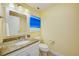 Bathroom featuring granite countertop, sink and toilet at 301 S Gulfview Blvd # 301, Clearwater Beach, FL 33767