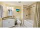Bathroom with shower and bath combination and neutral colored wall at 301 S Gulfview Blvd # 301, Clearwater Beach, FL 33767