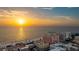 Great beach view of the condos and hotels on the beach, plus the setting sun at 301 S Gulfview Blvd # 301, Clearwater Beach, FL 33767